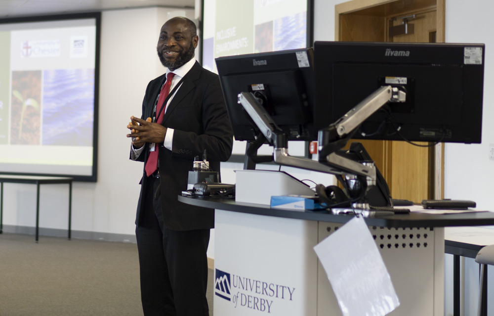 Dr Eghosa Ekhator giving a presentation.
