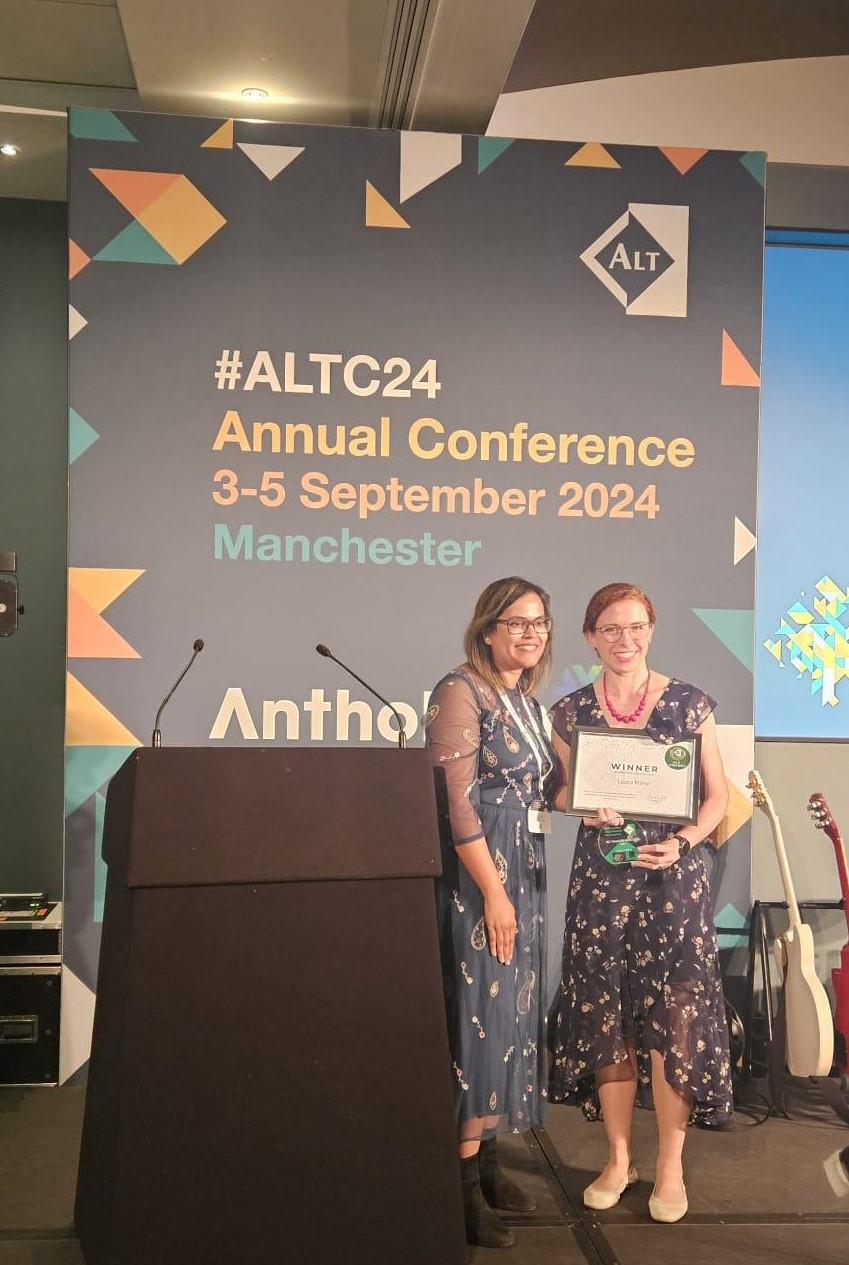 Laura Milne receiving her award.