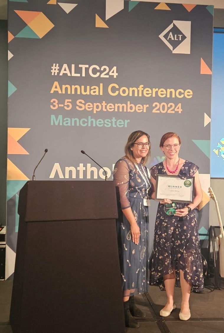Laura Milne receiving her award.