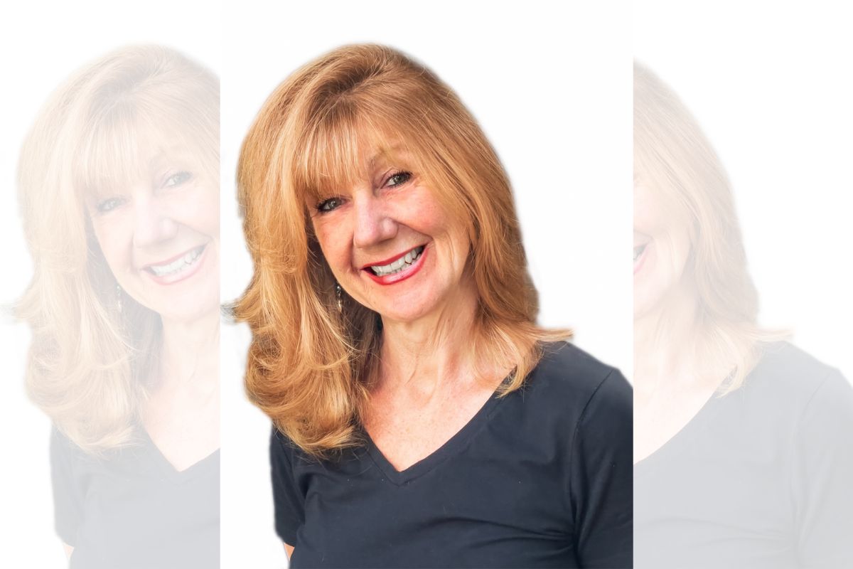 Dr Michelle Tytherleigh, Senior Lecturer in Psychology facing the camera, smiling. Background is white.