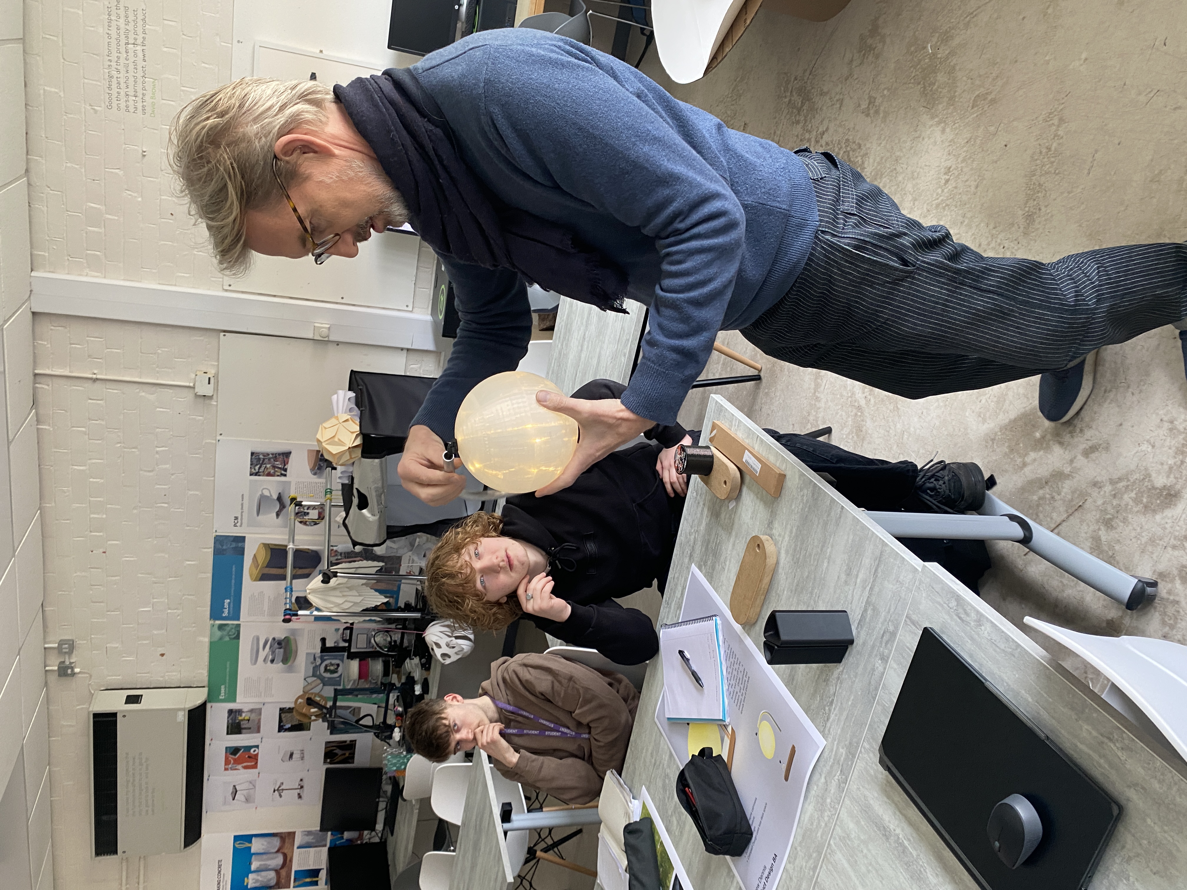 students being showed a light fitting