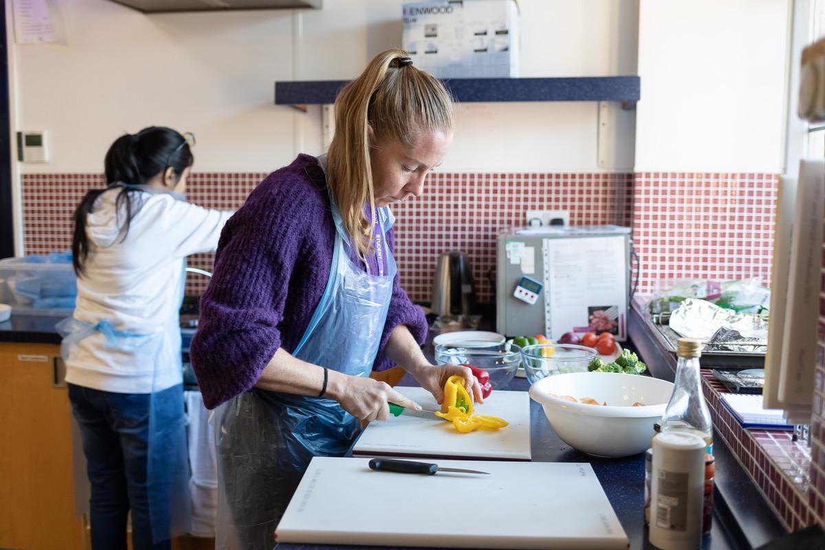 Students preparing healthy meals in a nutrition laboratory, representing the Nutrition and Dietetics MSc at the University of Chester.