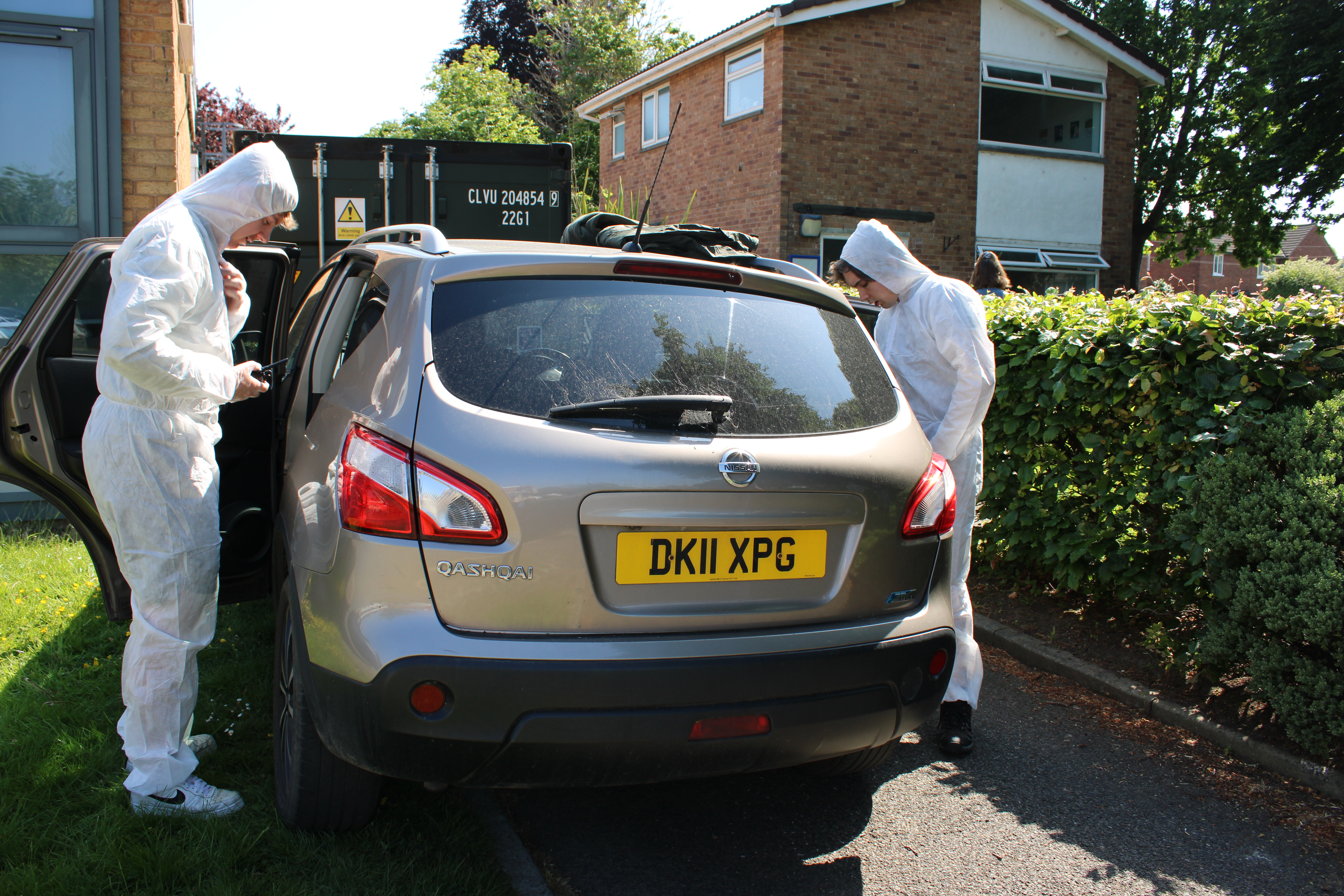 students searching car house raid