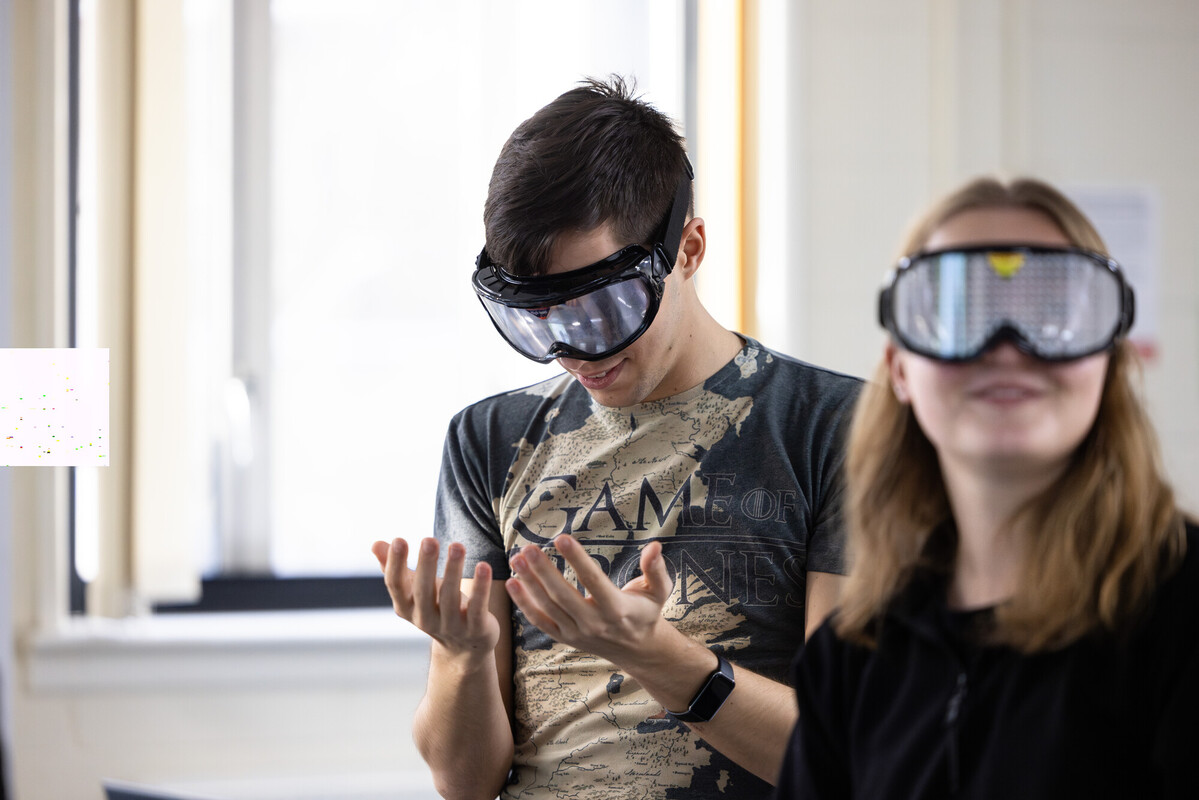 Students enjoying using equipemnt in Psychology lab