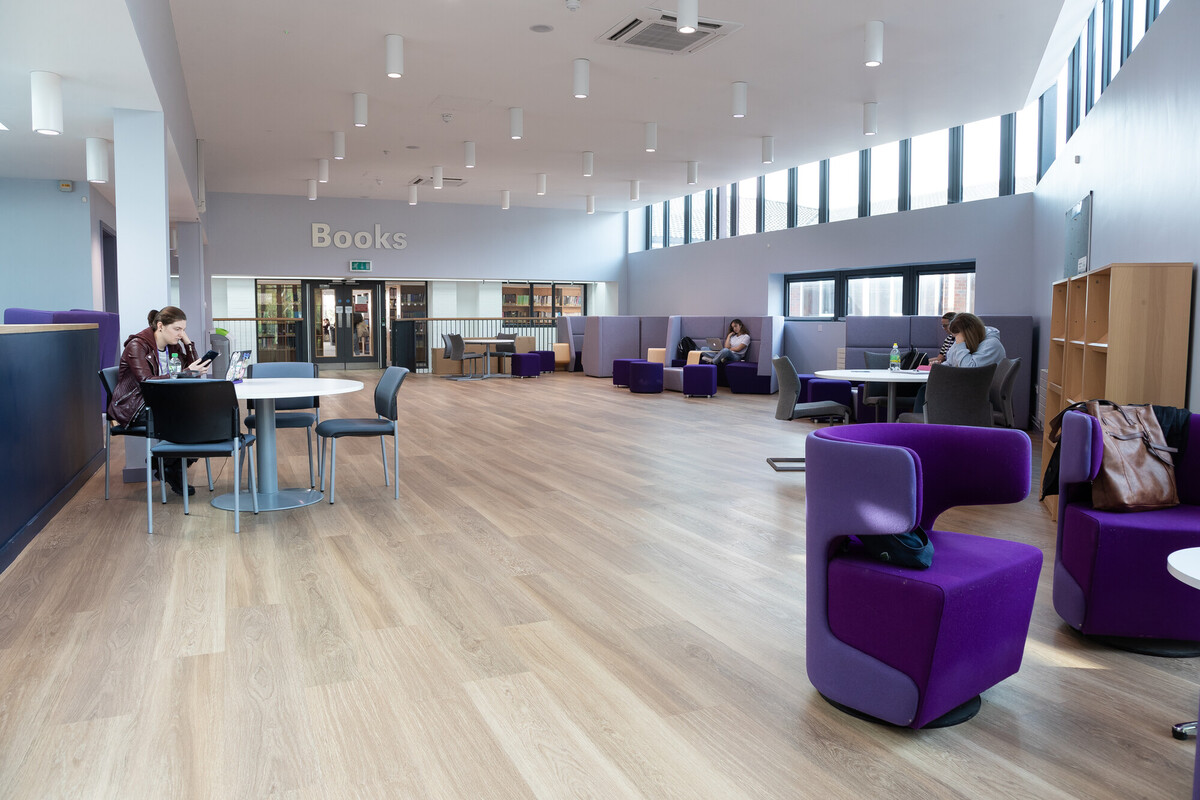 Seaborne library, with students seated next to tables mixing with others.