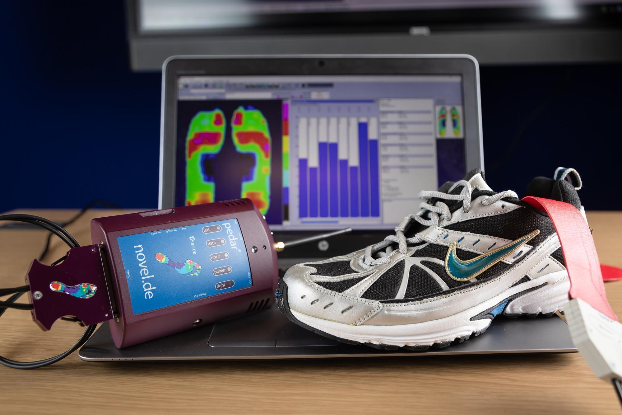 Sport and Exercise Sciences MRes student research equipment including a pressure mapping device, running shoe and laptop displaying biomechanical data analysis, highlighting advanced sport and exercise science research, performance analysis and human movement studies.