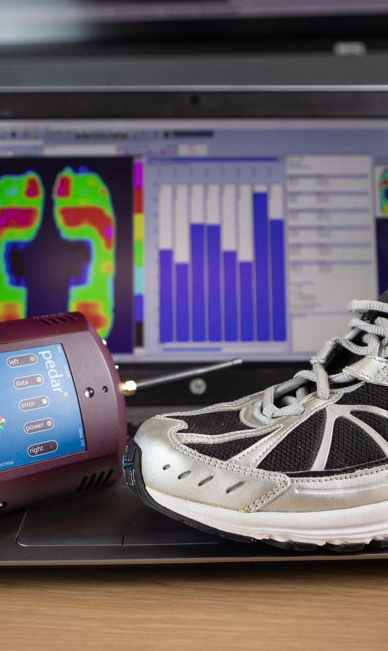 Sport and Exercise Sciences MRes student research equipment including a pressure mapping device, running shoe and laptop displaying biomechanical data analysis, highlighting advanced sport and exercise science research, performance analysis and human movement studies.