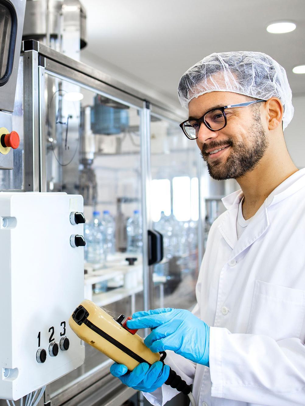 Food Innovation MSc student operating advanced food processing equipment in a food science laboratory, demonstrating food product development, food manufacturing technology, quality assurance, and innovation within the food industry.