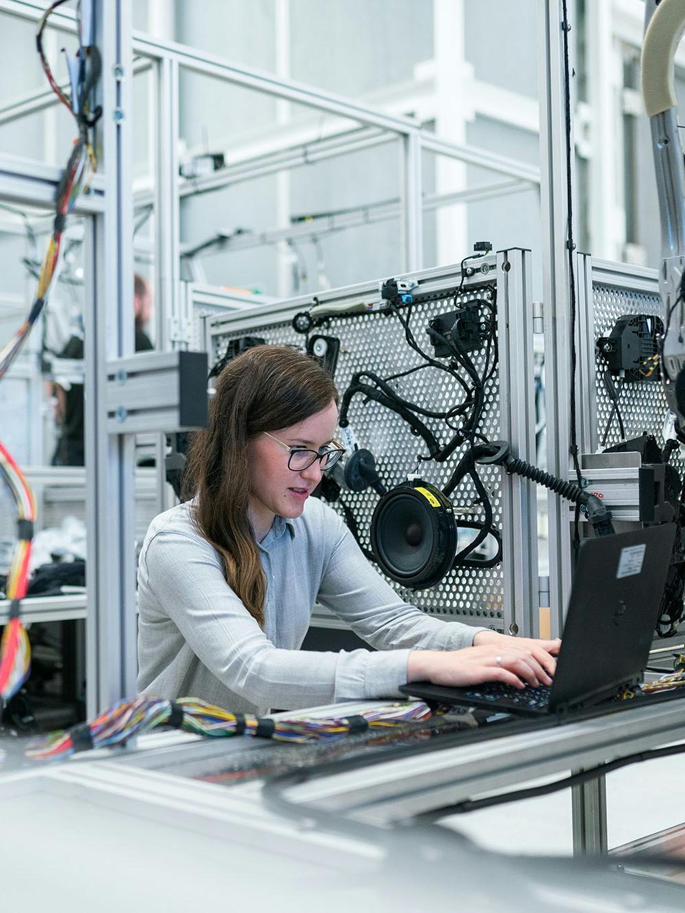 Female electronics engineer runs vehicle tests