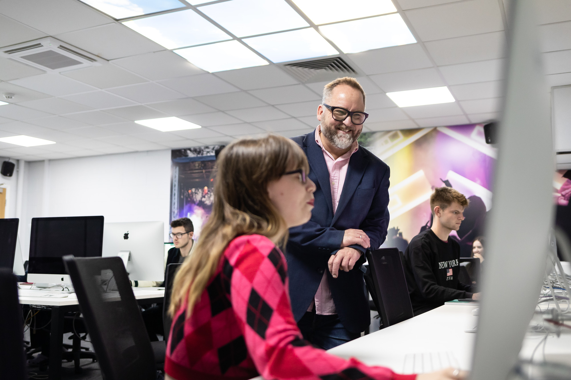 Lecturer helping a student