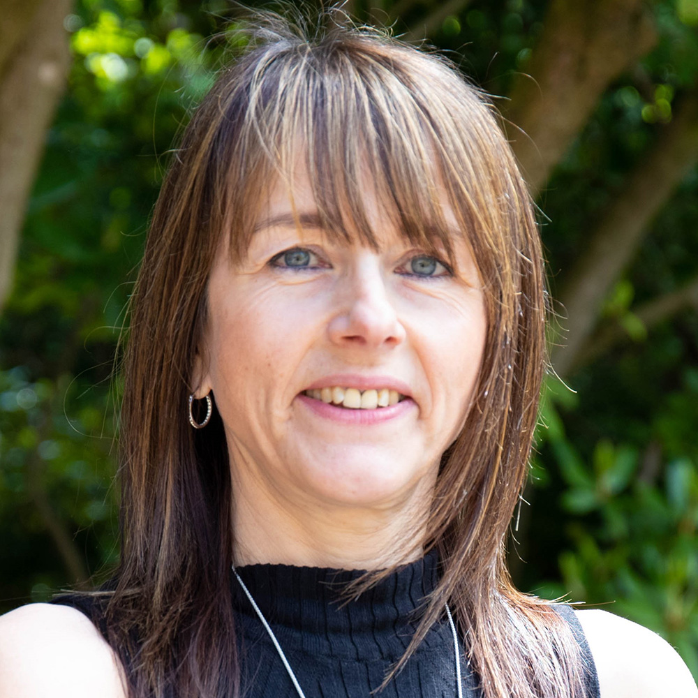 A profile portrait photo of Dr Paula Hamilton